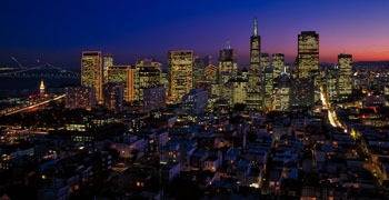 Vast Los Angeles skyline at dusk with traffic flowing