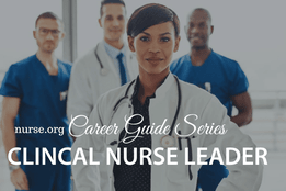 Female healthcare professional in front of nurses and doctor